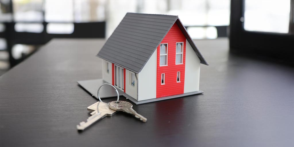 Modello di casa con chiavi – informazioni per i proprietari di immobili sulla rete in fibra ottica FTTH di Chiasso4net